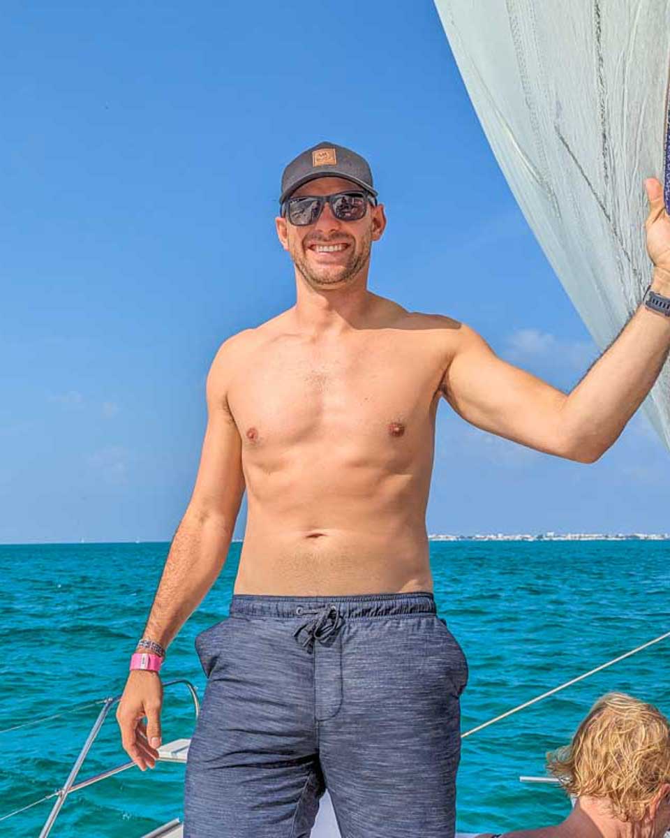 Daniel-poses-for-a-photo-on-a-catamaran-cruise-from-Aruba