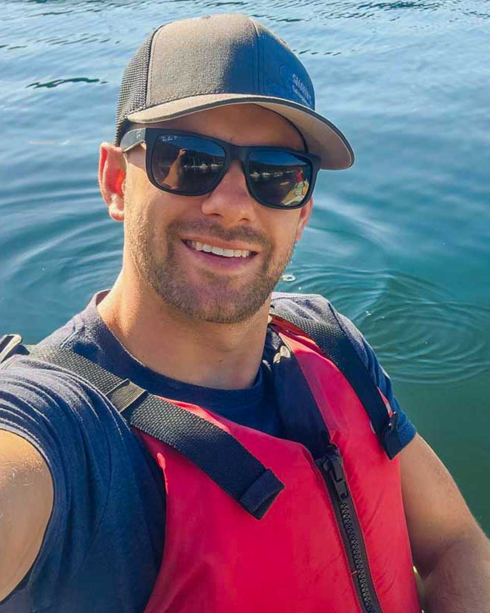 Daniel-takes-a-selfie-while-kayaking-in mangroves on a tour from Singapore