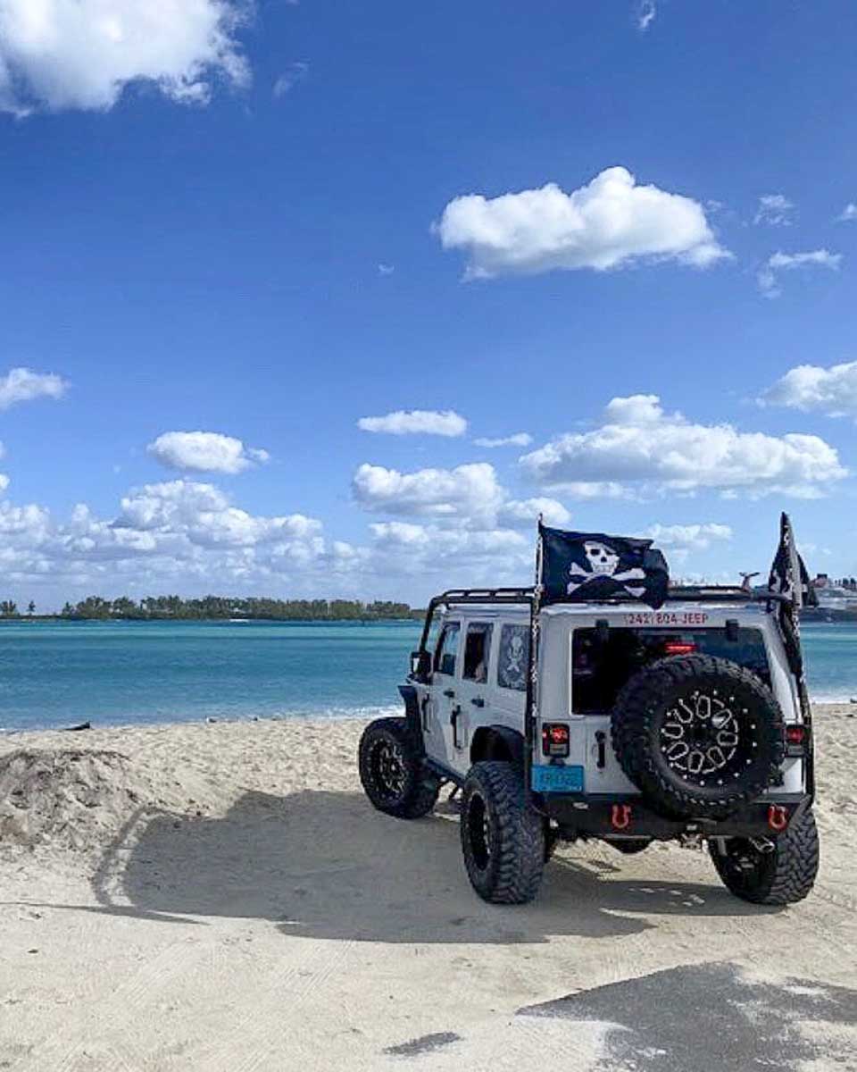 Pirate Jeep Tours a jeep sits on the beach on a pirate tour in Nassau Bahamas