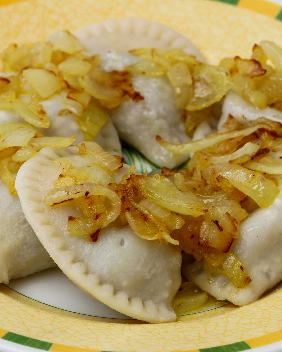 Polish dumplings garnished with fried onions on a food tour in Krakow Poland