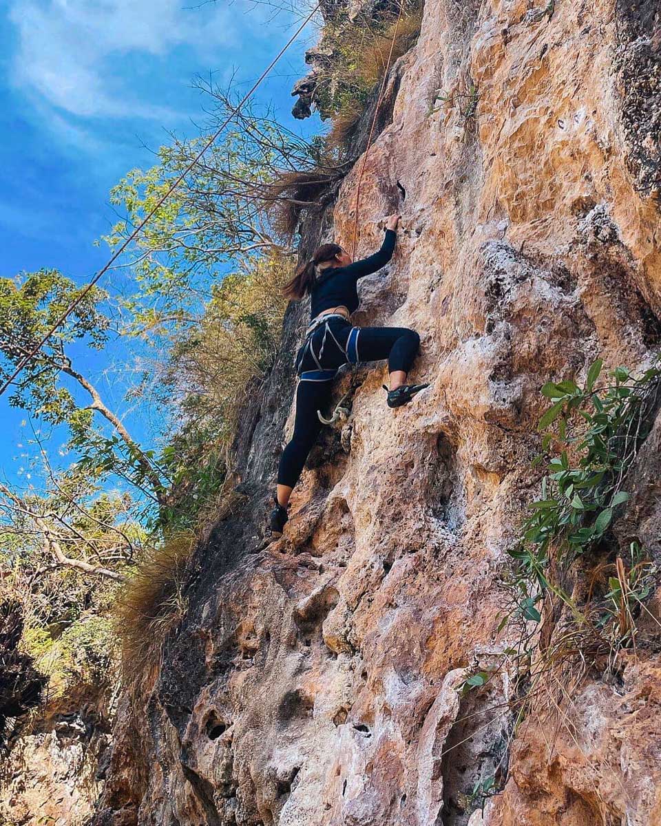 Real Rocks Climbing a person climbs near Krabi Thailand
