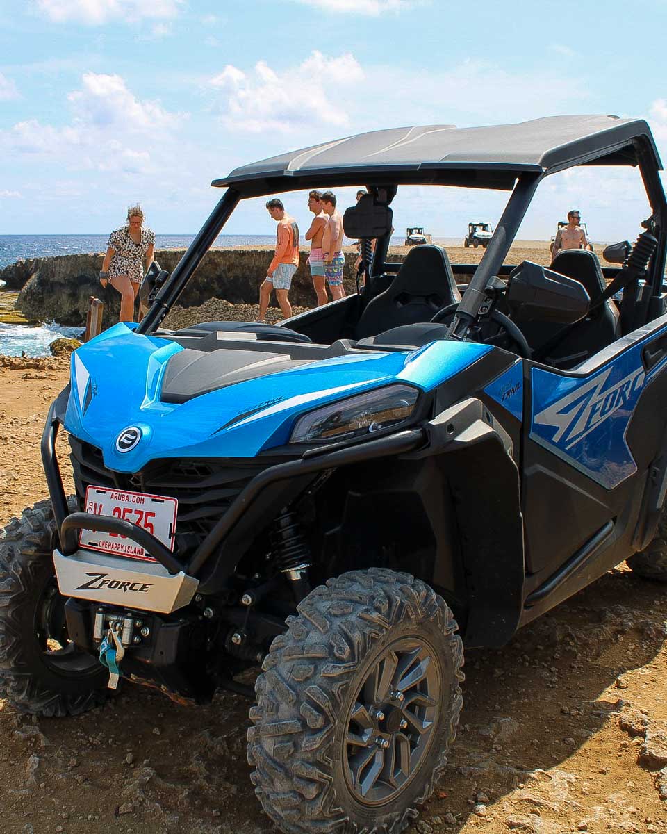 RockaBeach Tours an ATV parked on the coast in Aruba