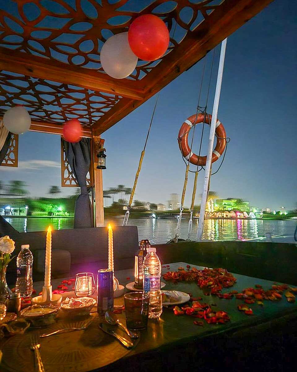 Tarzan Egypt Tours a boat cruises down the Nile River at night on a tour from Cairo Egypt