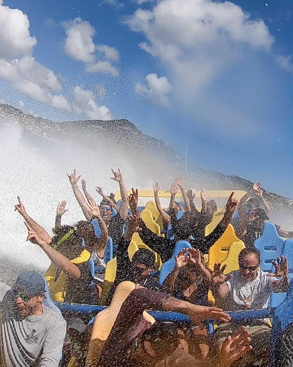 VI Jet Boat Tours a jet boat with people having fun on a tour in St Thomas Virgin Islands