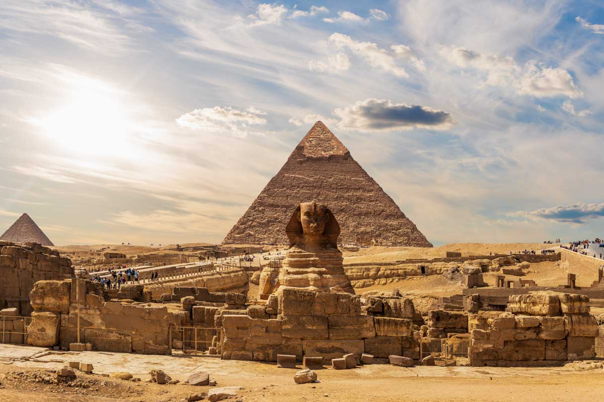 View of the pyramids in Cairo Egypt and a cloudy sky