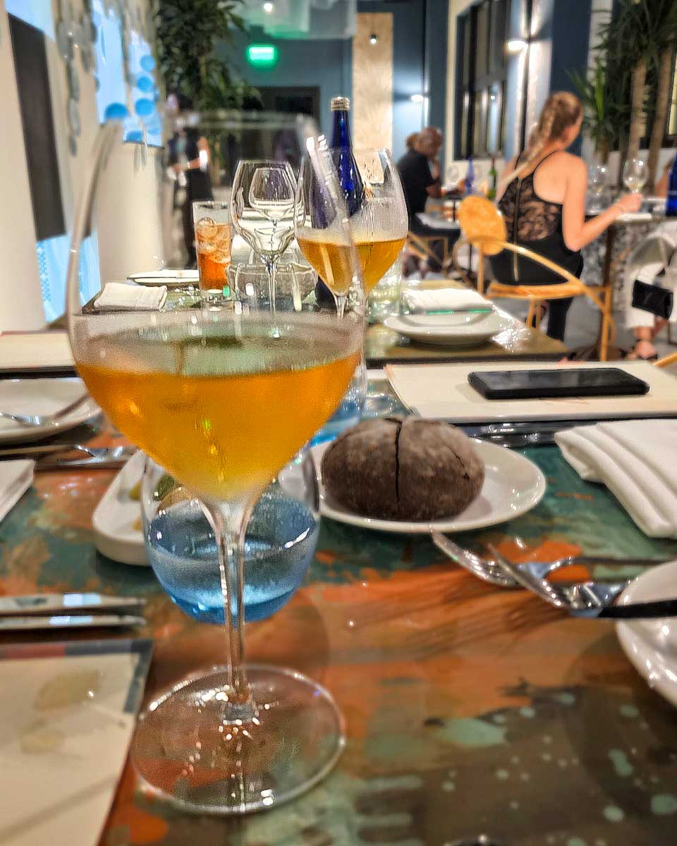ΖOΗ Restaurant wine on a table on a food tour in Curacao
