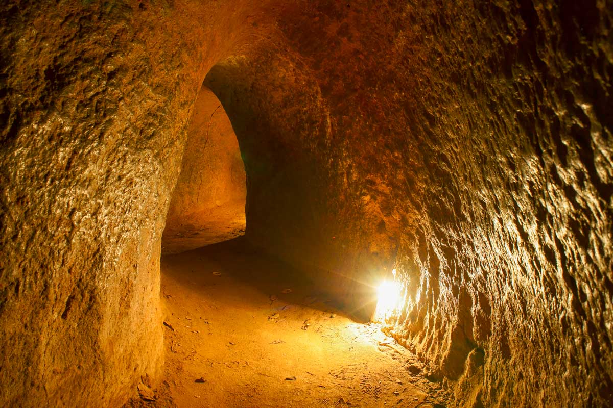 Cu Chi tunnel with underground dugout Vietnam