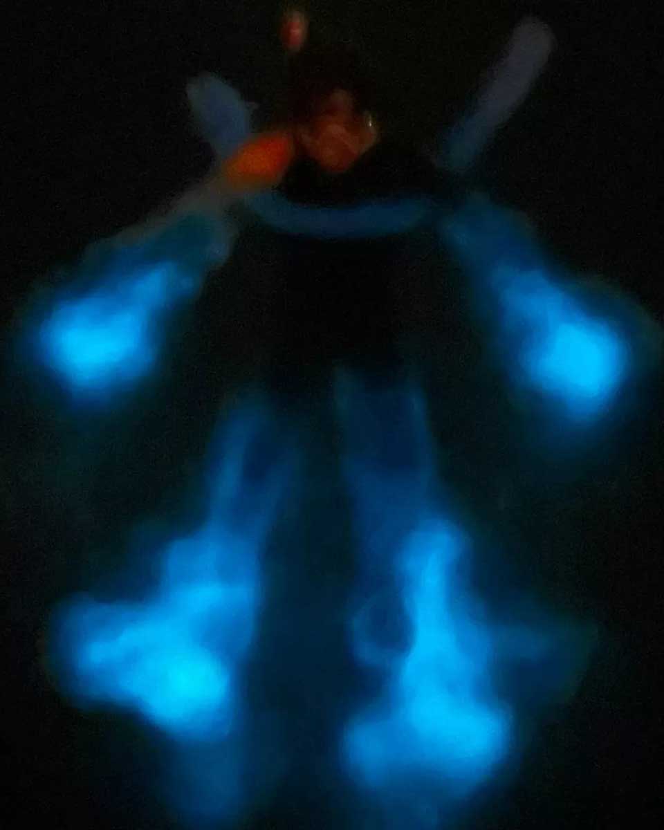 George's Watersports a person swims in Bioluminescence in Grand Cayman