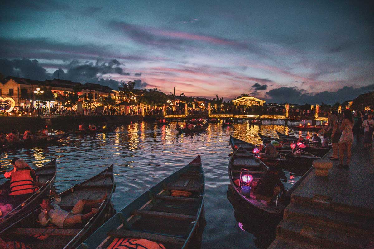 Hoi An market at night with boats in the water Vietnam