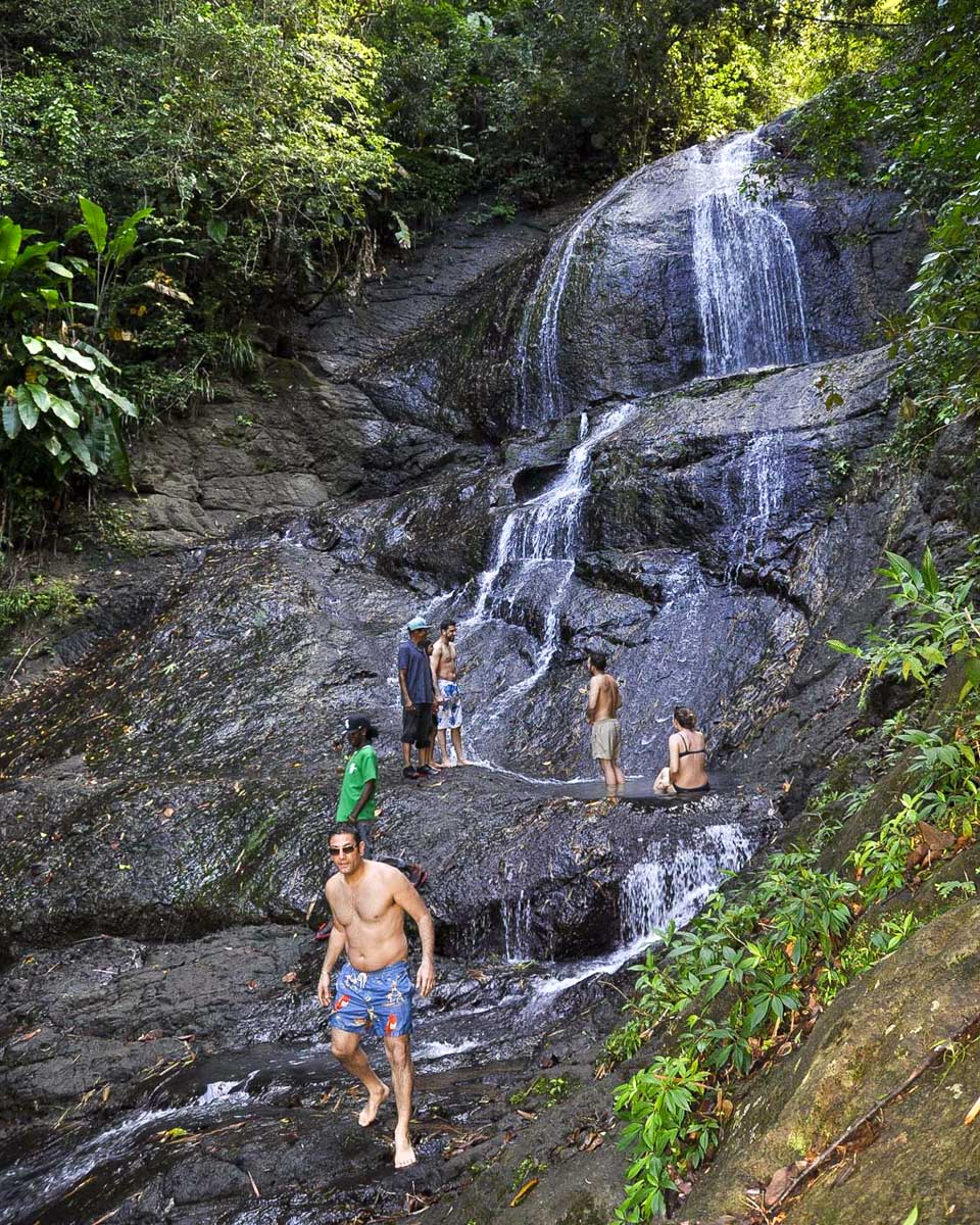 Island Adventures- St. Lucia people at a waterfall after a hike in St Lucia