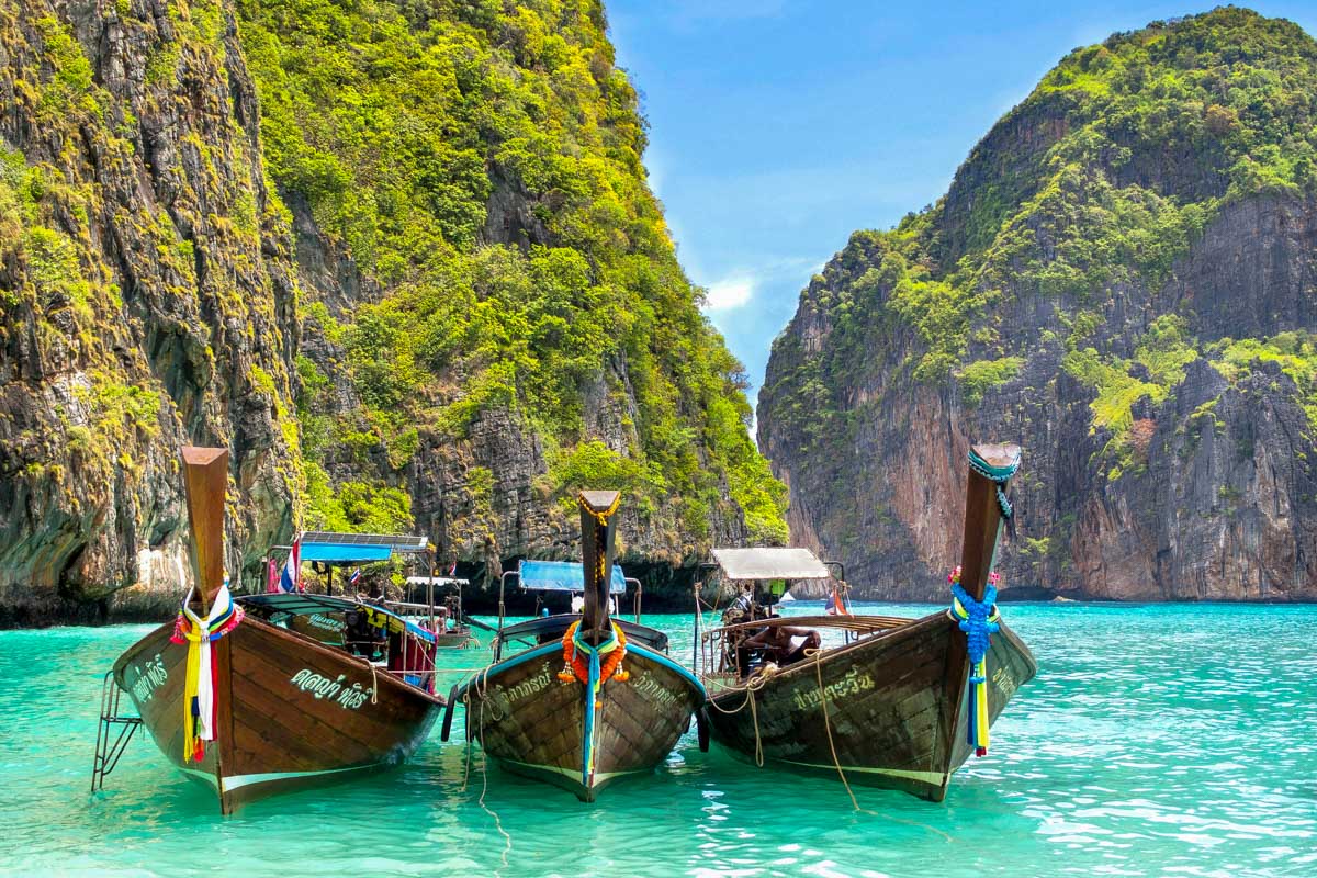Longtail boats in Maya Bay on a tour of Phi Phi Thailand