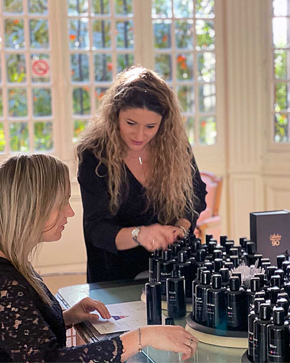 Molinard Parfums a woman helps a person make perfume in Nice France