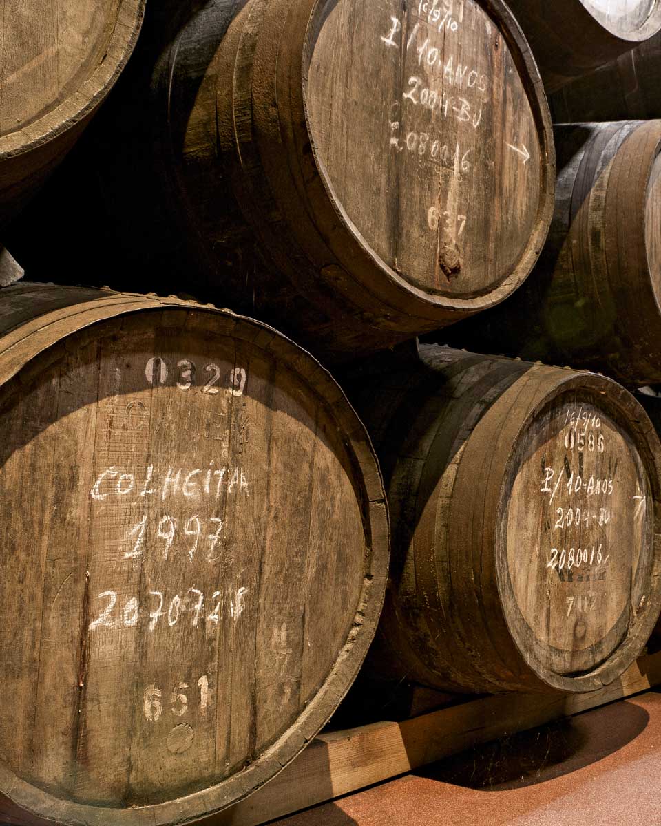 Port barels aging in a basement on a tour from Porto Portugal