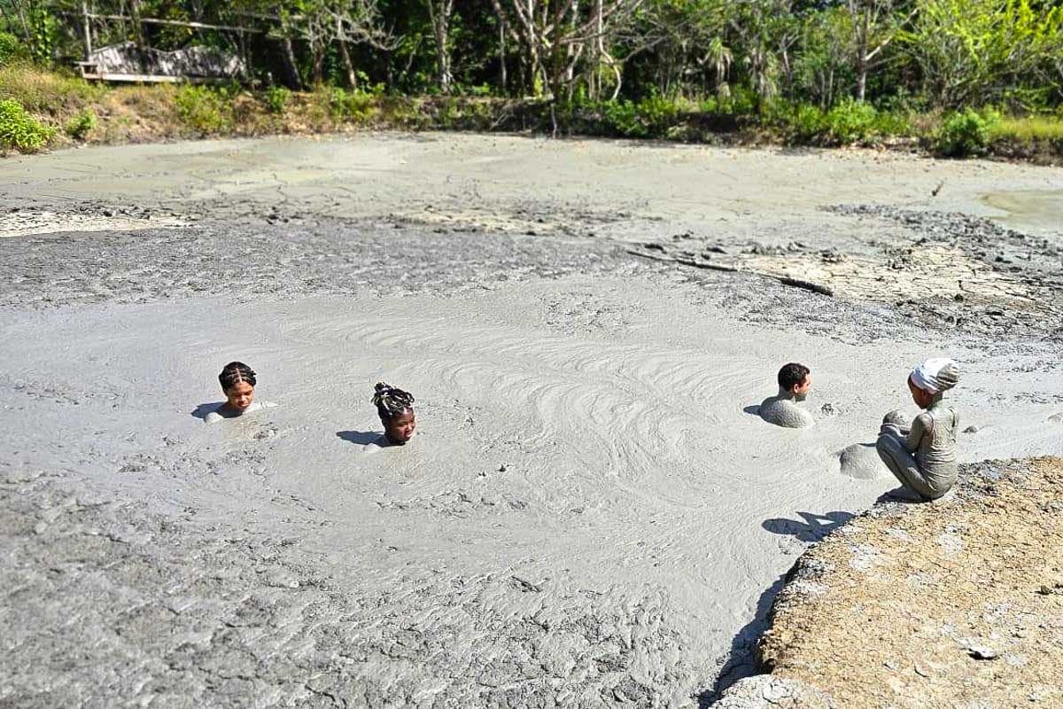 Sensational Tours and Transport people take a mud bath in Trinidad