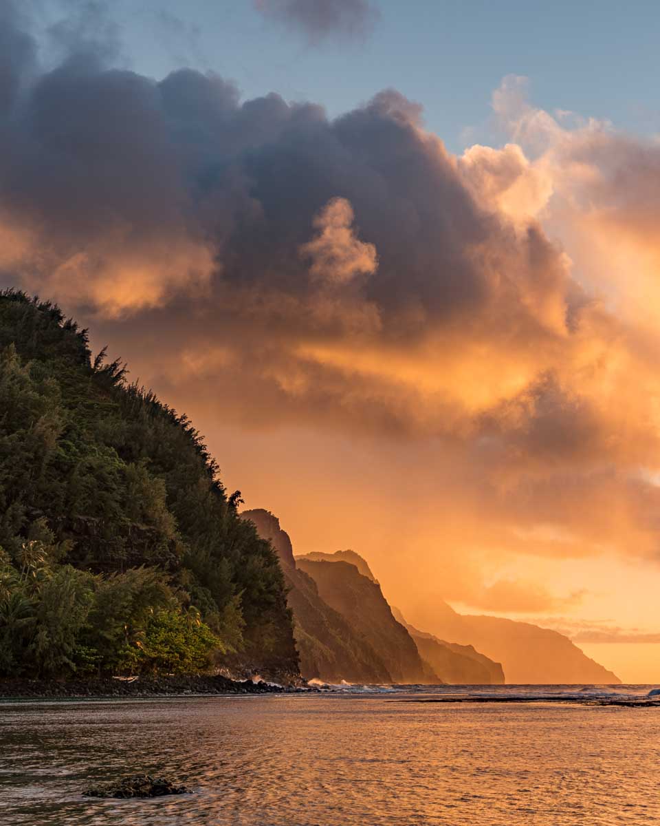 The Na Pali Coast seen on a sunset dinner cruise in Kauai Hawaii