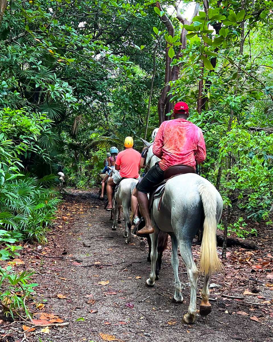 Xplore Roatan people horseback ride on a tour in Roatan Honduras