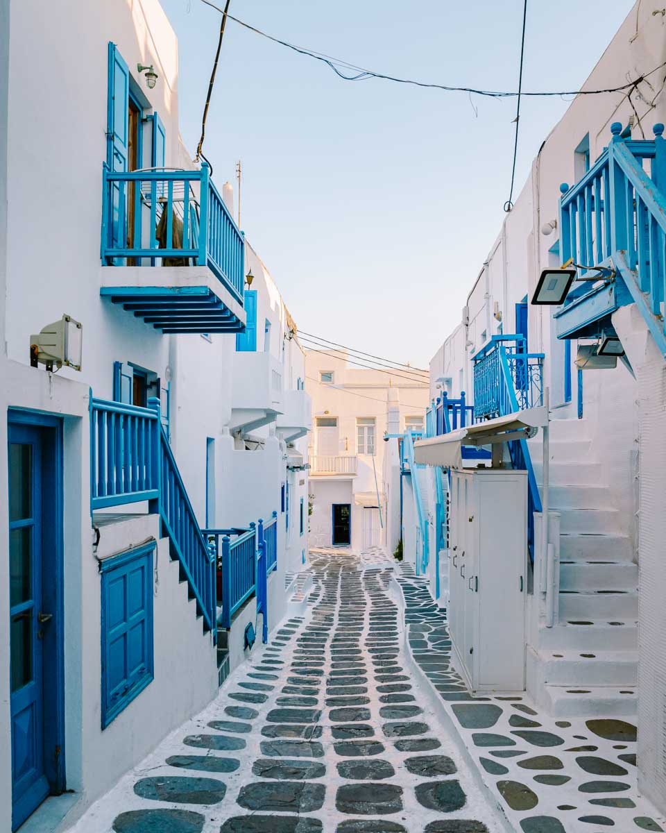 A white and blue street in Little Venice seen on a tour in Mykonos Greece