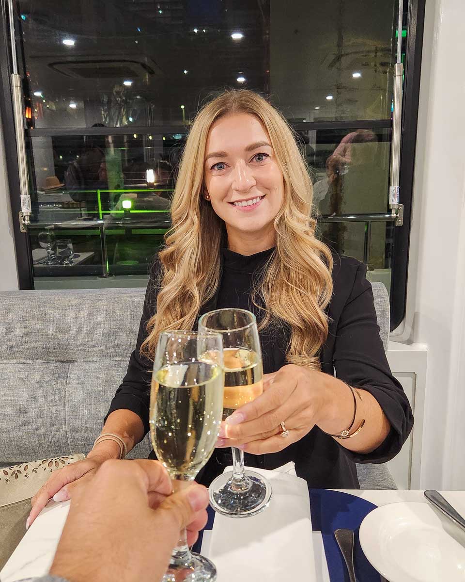 Bailey-does-a-cheers-with-champange-on-a-Seine-River-Cruise-in-Paris-France