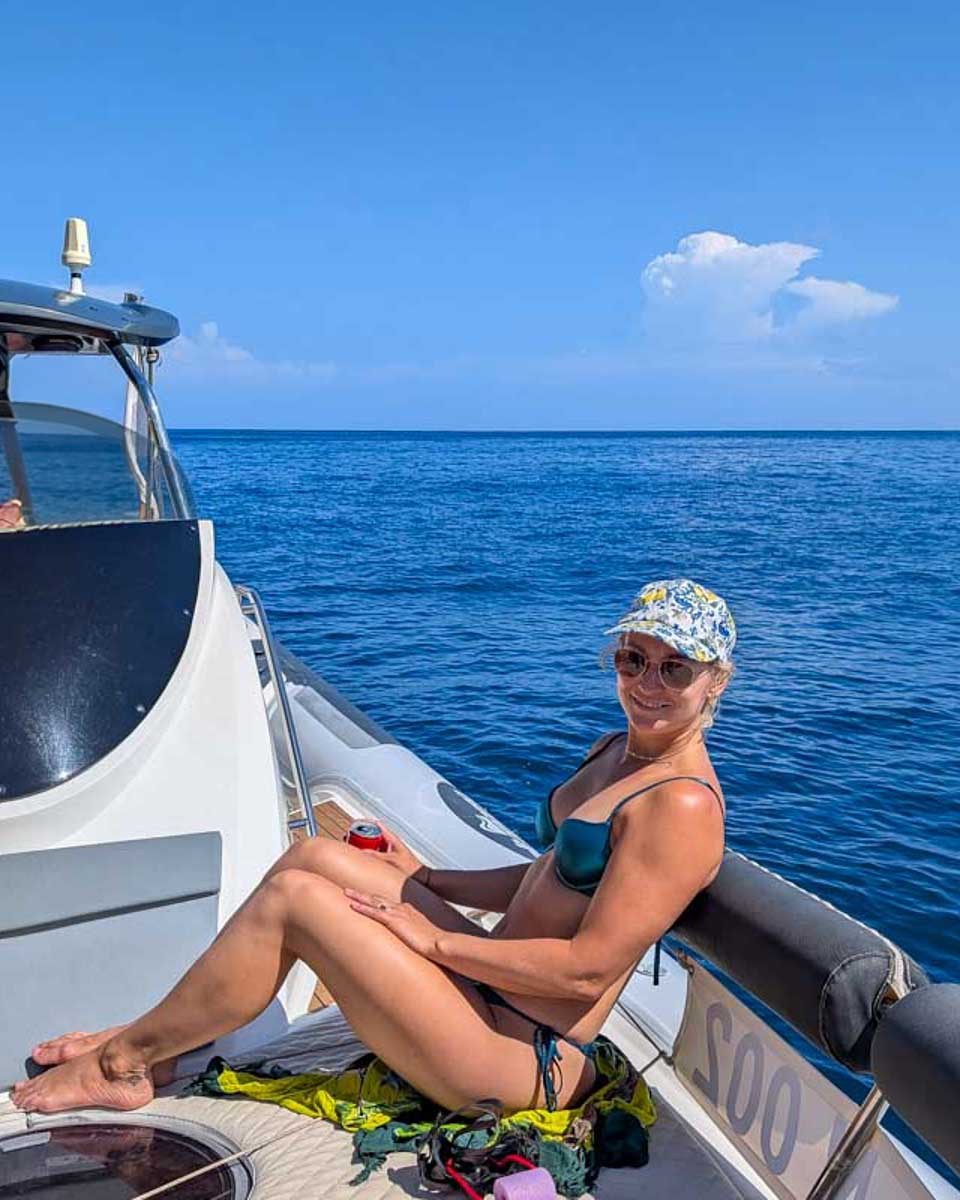 Bailey-sits-on-a-boat-on-a-boat-tour-in-Mallorca Spain