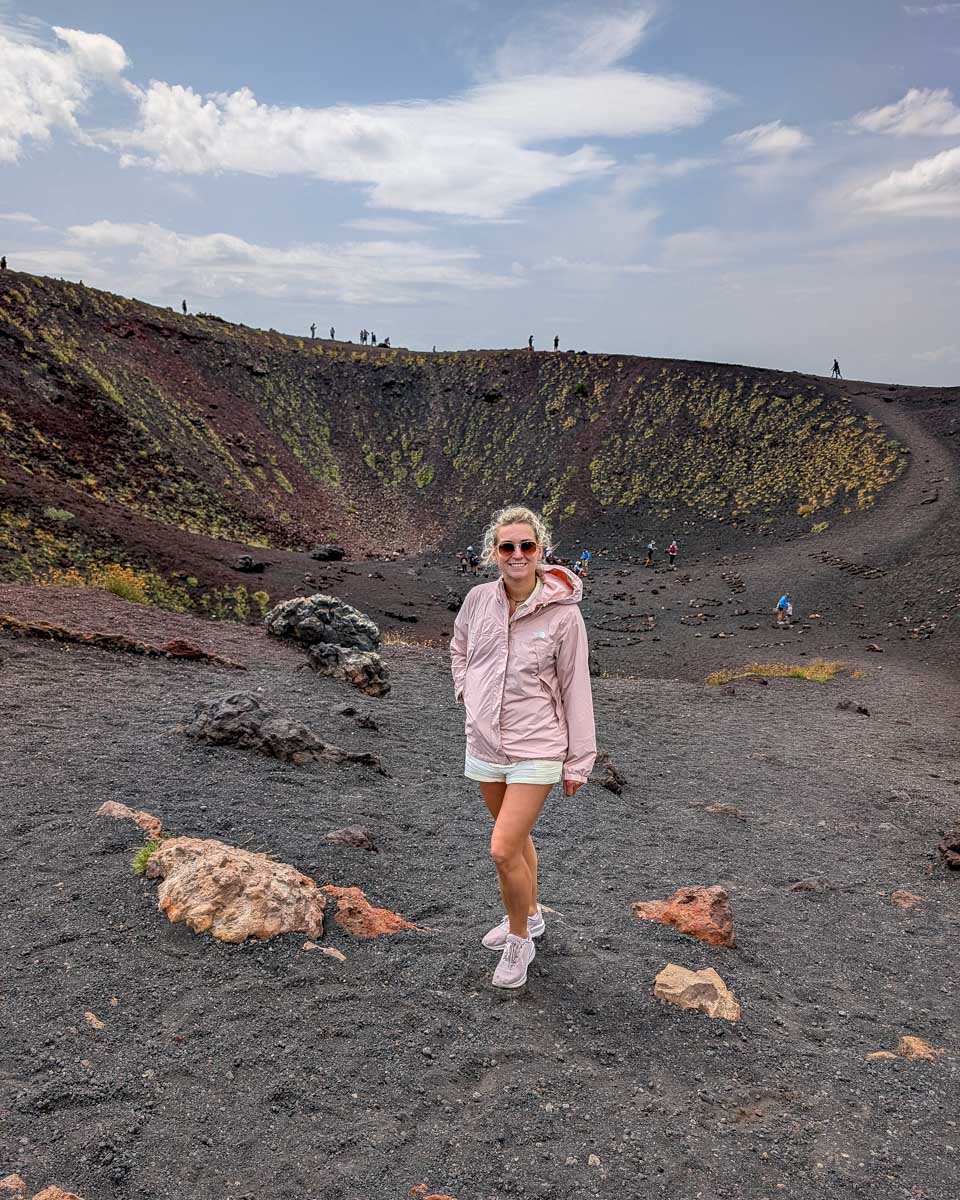 Bailey-stands-by-a-crater-on-Mt-Etna-on-a-tour-to-Mt-Etna-from-Catania Sicily-Italy