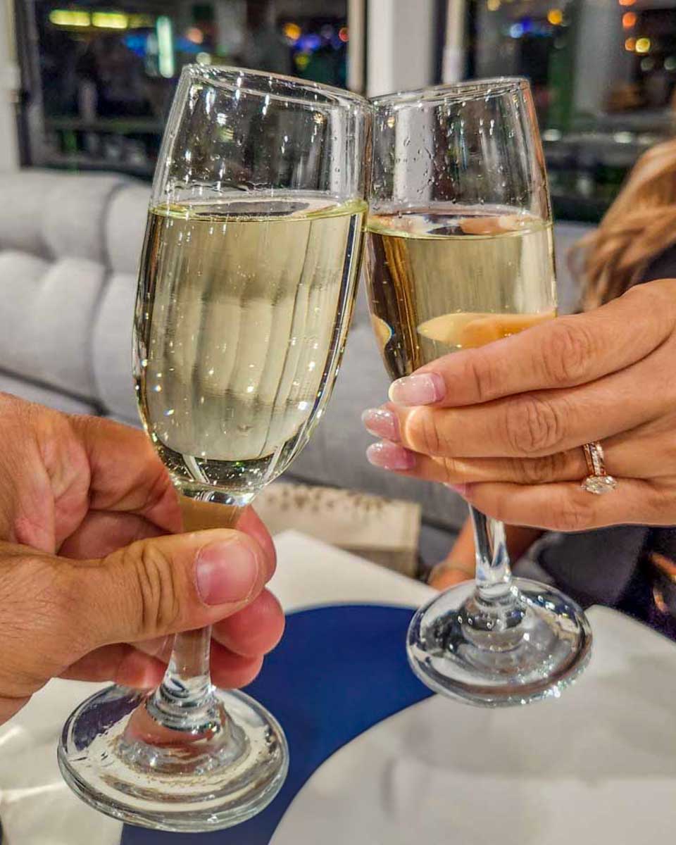 Cheers-with-Champagne-on-a-cruise in Paris France on tour of the Eiffel Tower