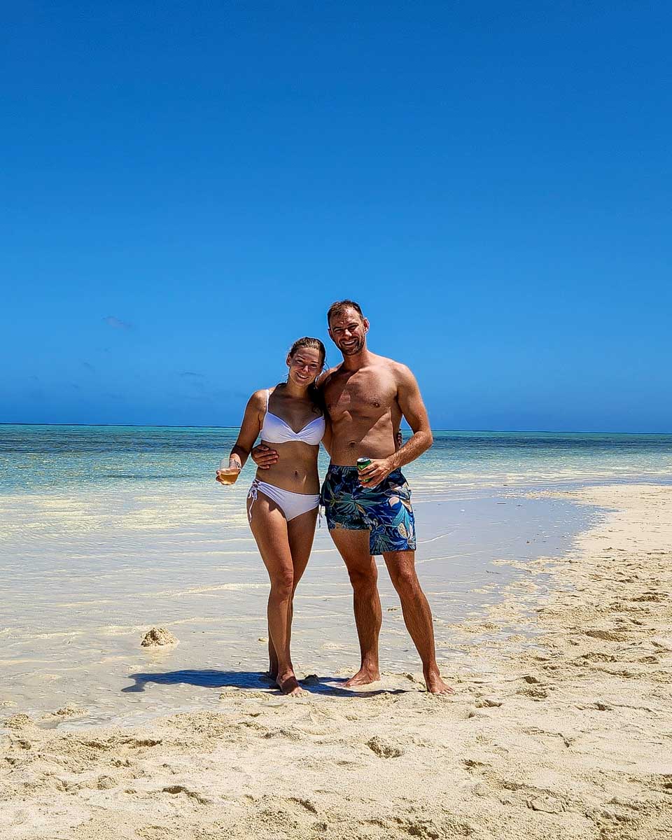 Daniel-and-Bailey-stand-on-a-beach-on-a-tour-from-Turks and Caicos