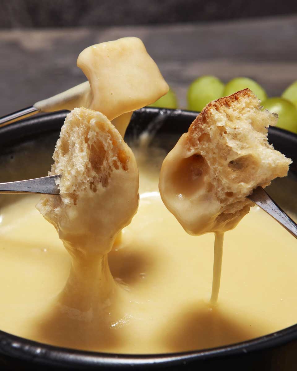 Fondue-being-eaten-on-a-tour-in-Geneva-Switzerland