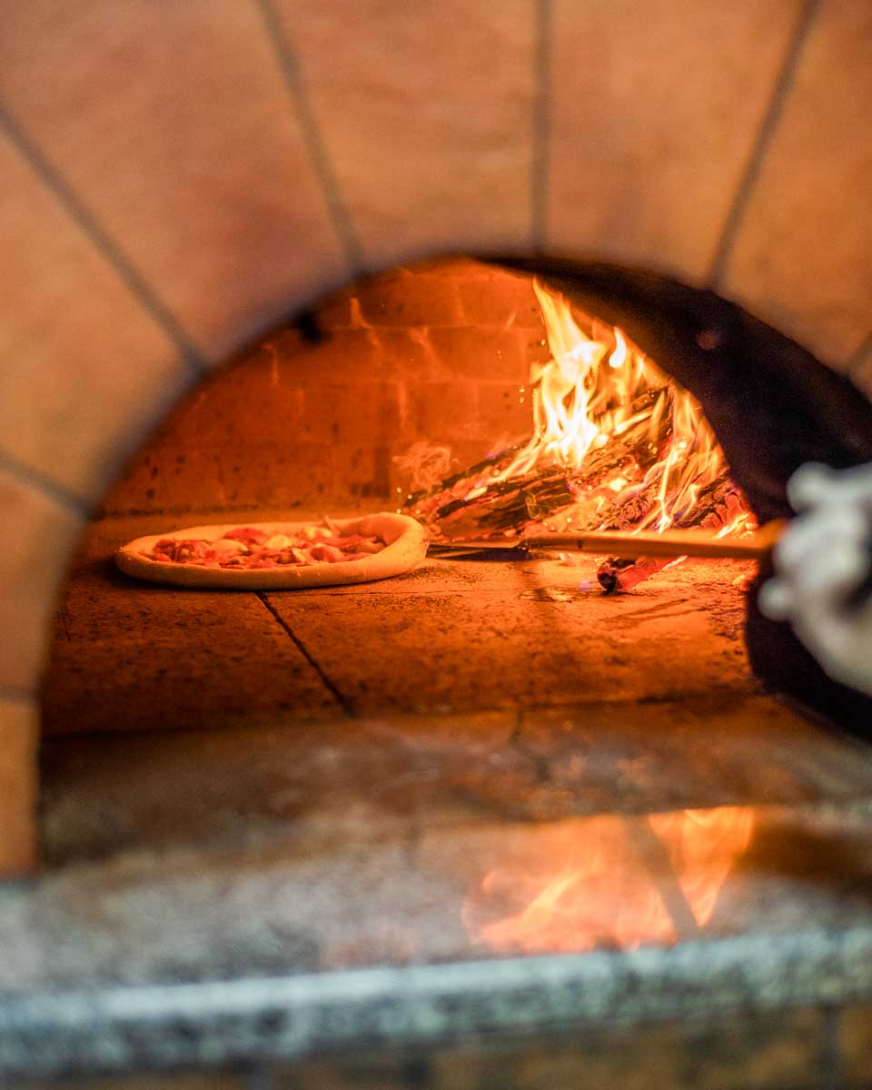 Pizza in the oven during a cooking class in Florence Italy