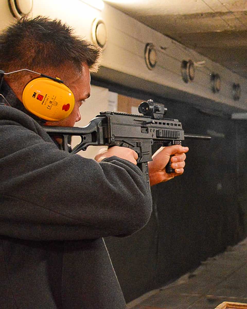 Shooting Range Riga a man fires a gun on a tour in Riga Latvia