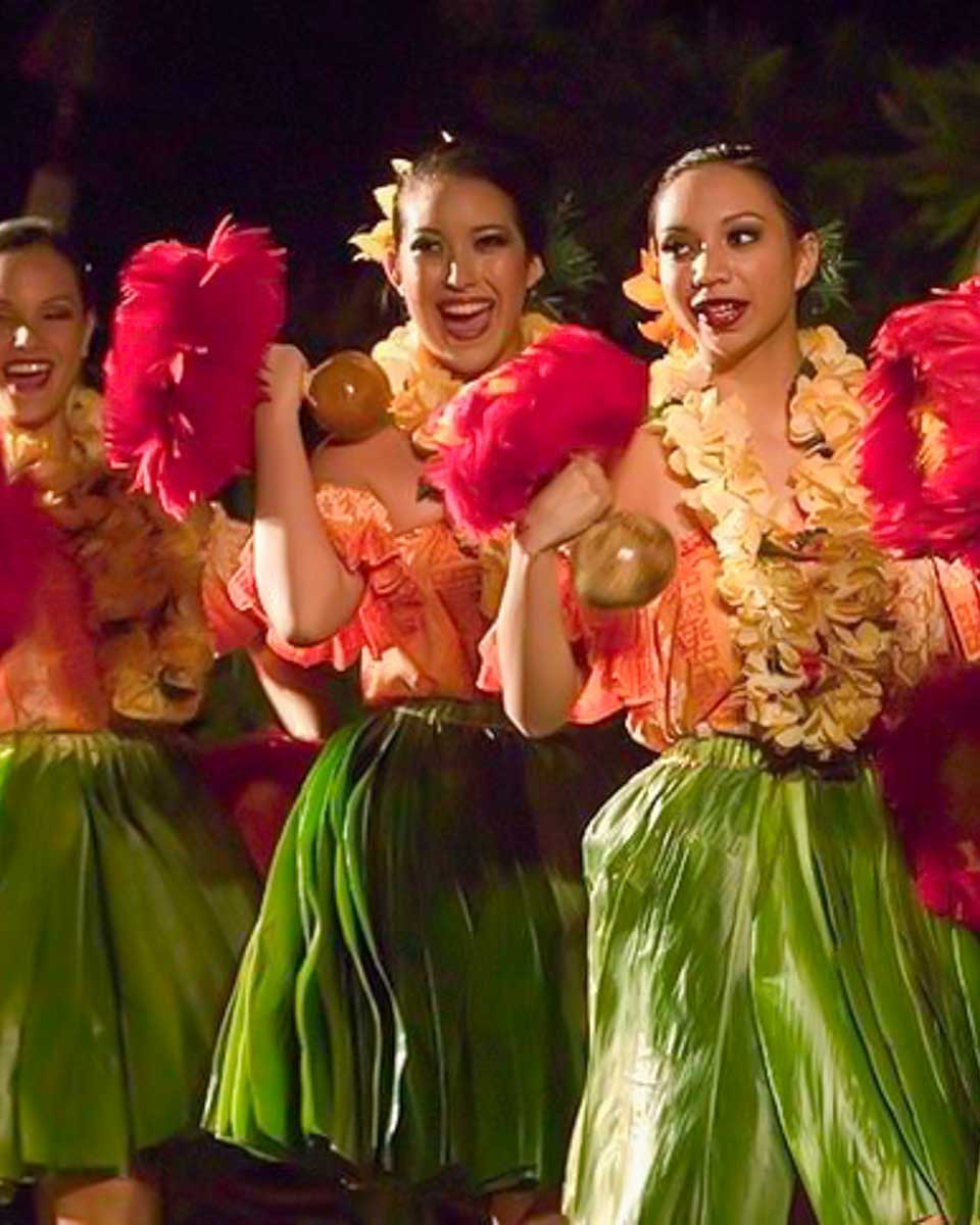 Voyagers of the Pacific Luau women dance at a luau on Big Island Hawaii