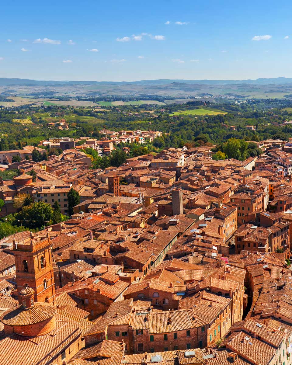 torre del mangia seen from a hot air balloon during a tuscany tour in Siena Italy
