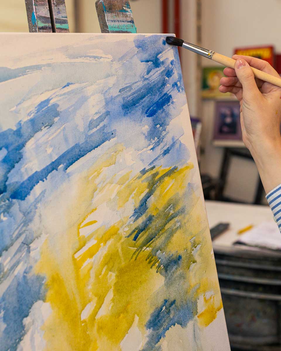 A person painting during a tour in Santa Fe New Mexico