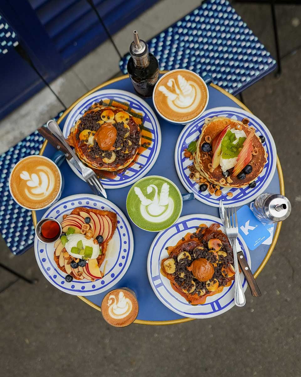 A table full of food and coffee at Kozy restaurant in Paris