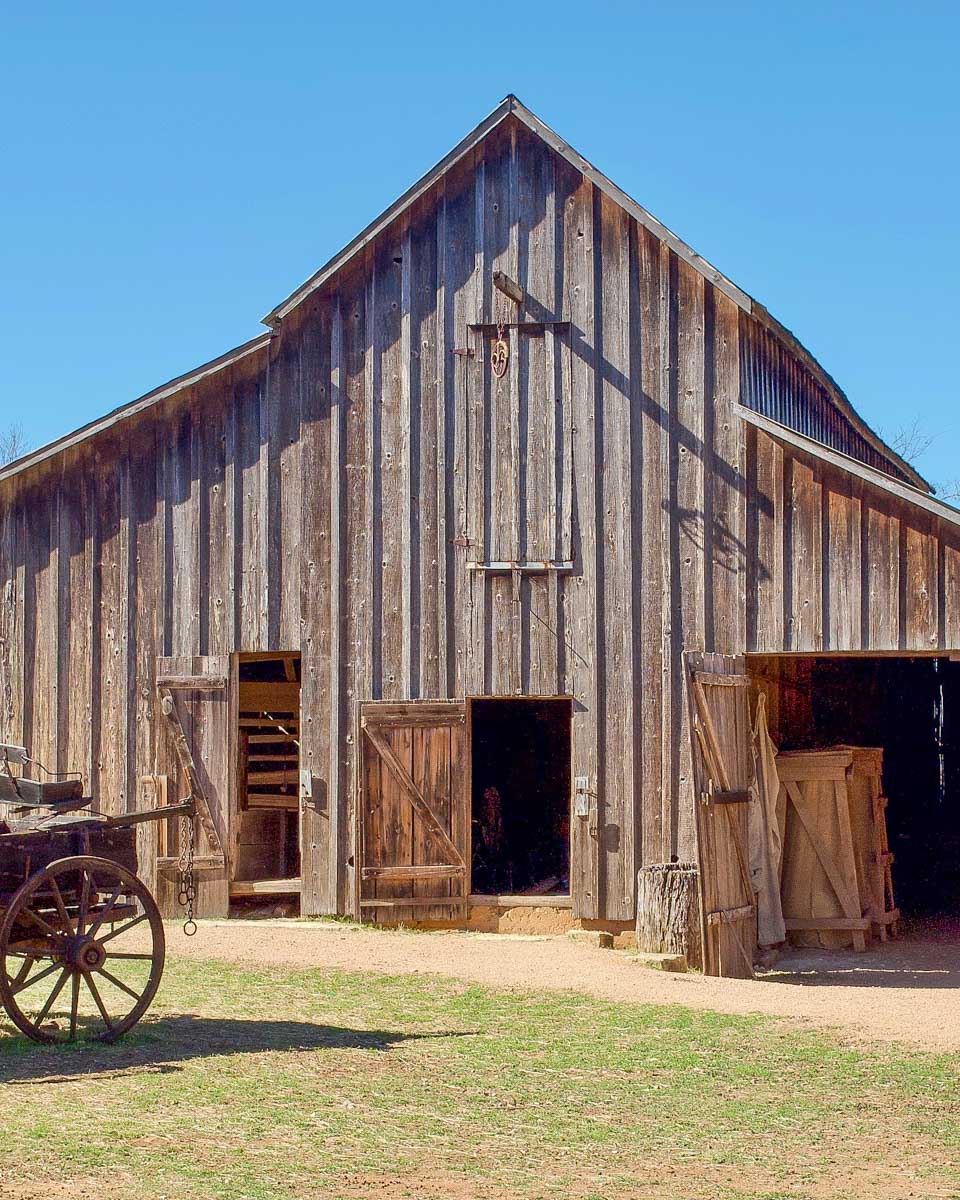 A wood barn and wagon at Lyndon B. Johnson State Park seen on a tour from San Antonio Texas