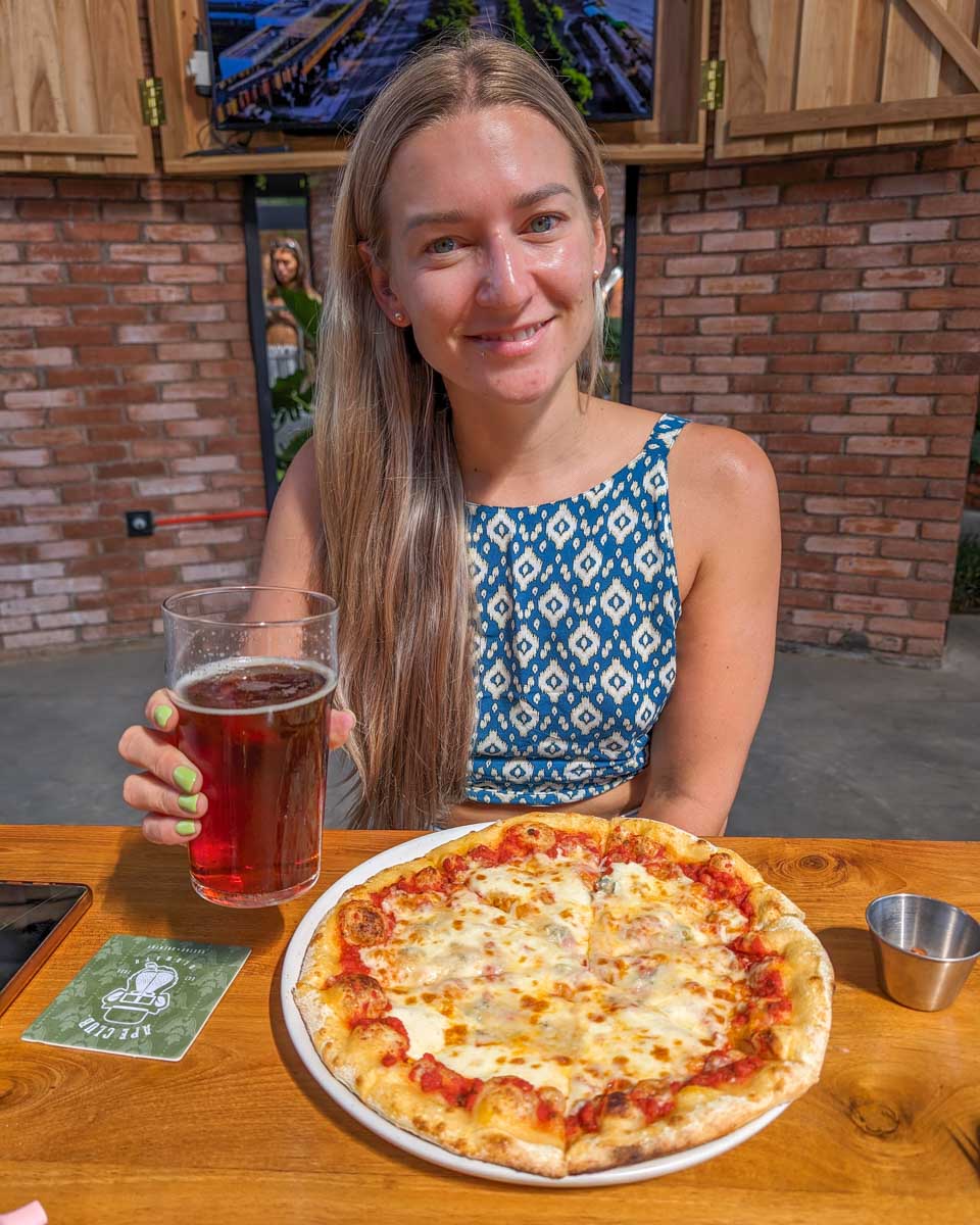 Bailey-enjoys-a-pizza-and-a-beer on a food tour in Manchester UK