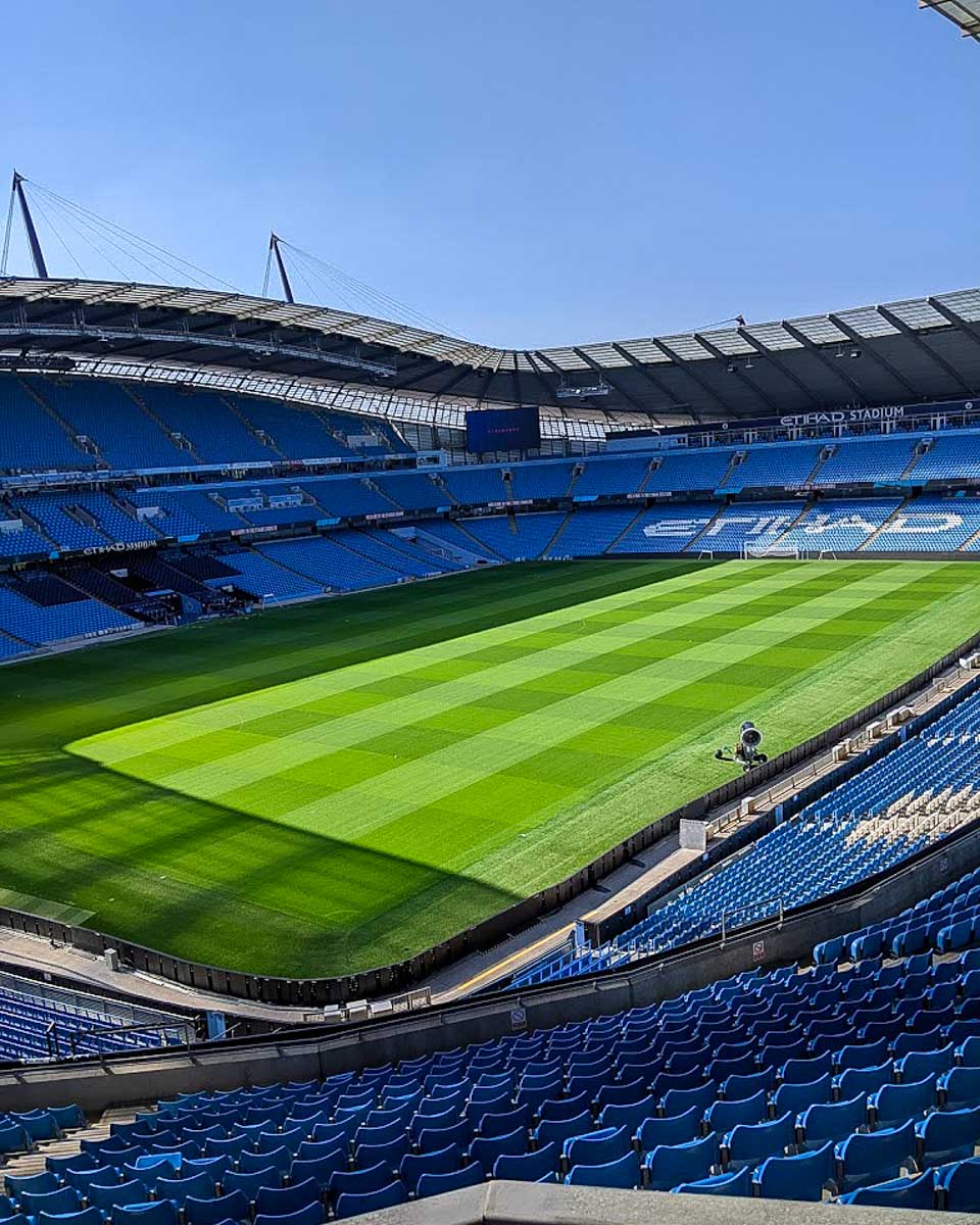 Manchester City Stadium and field in Manchester UK