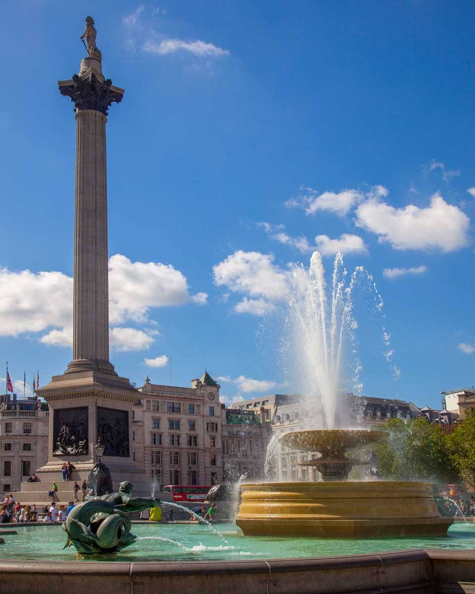 Nelsons Column and fountain at trafalgar square in London England