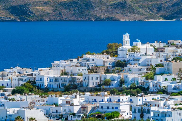 View of Plaka village with traditional Greek church in Milos Greece