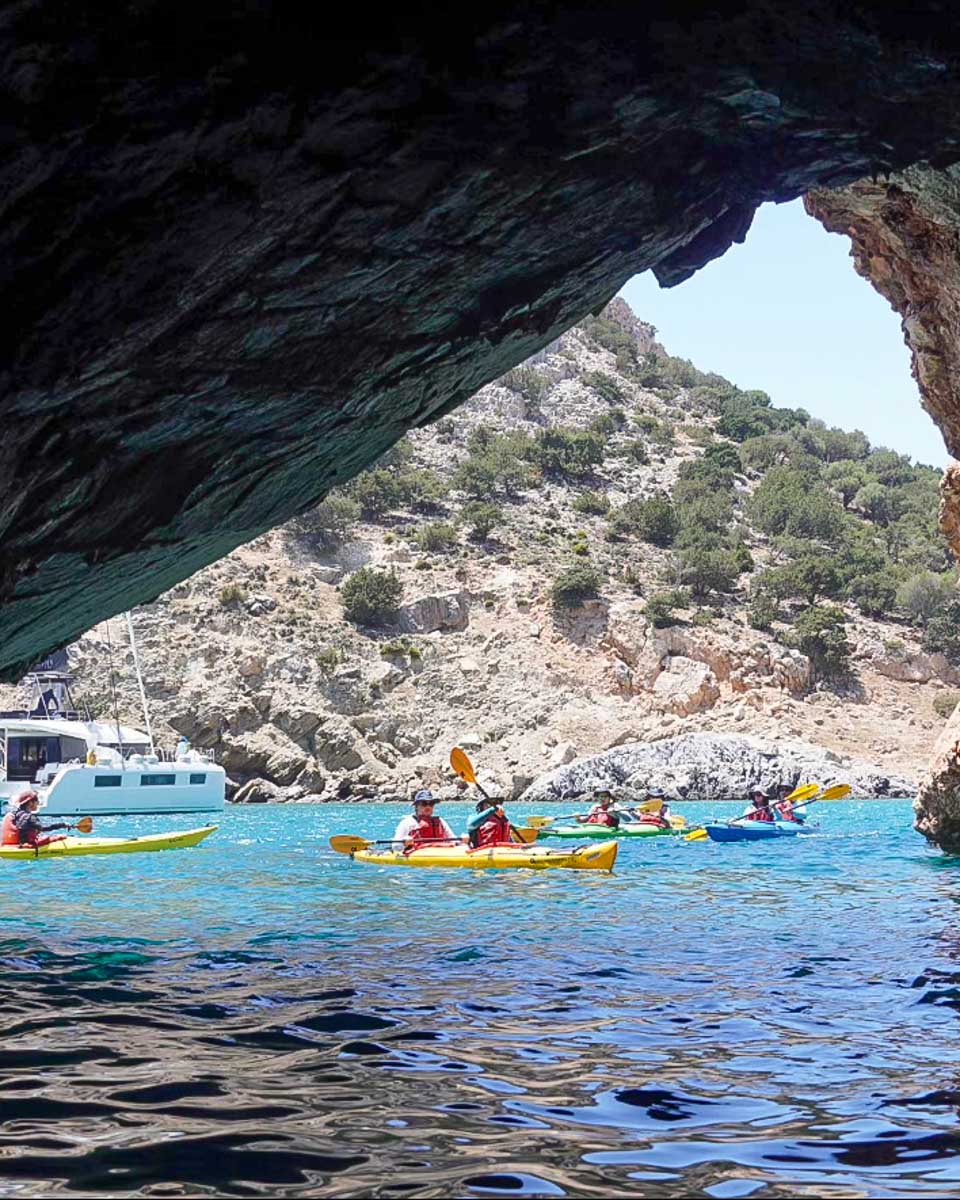 sea kayak naxos people kayak at Rina Cave on a tour from Naxos Greece