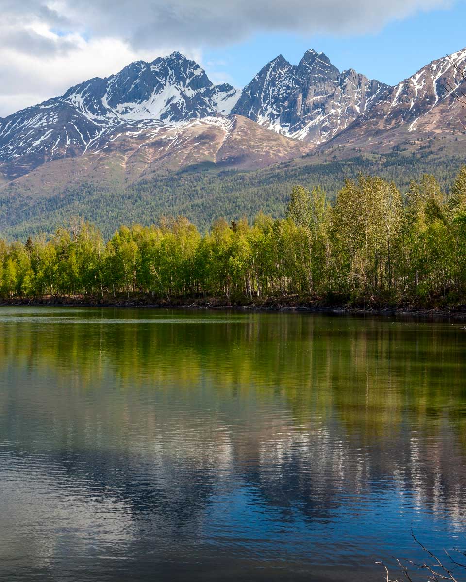 A lake and the Chugach Mountains seen on a scenic tour from Fairbanks Alaska
