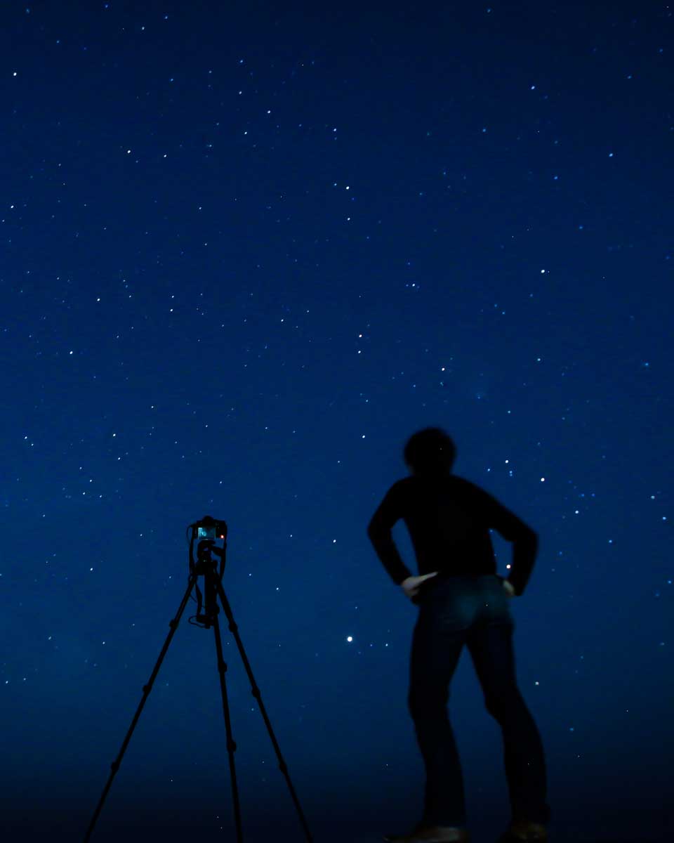 A-man-stargazing-in-the-desert-from-the Canary Islands