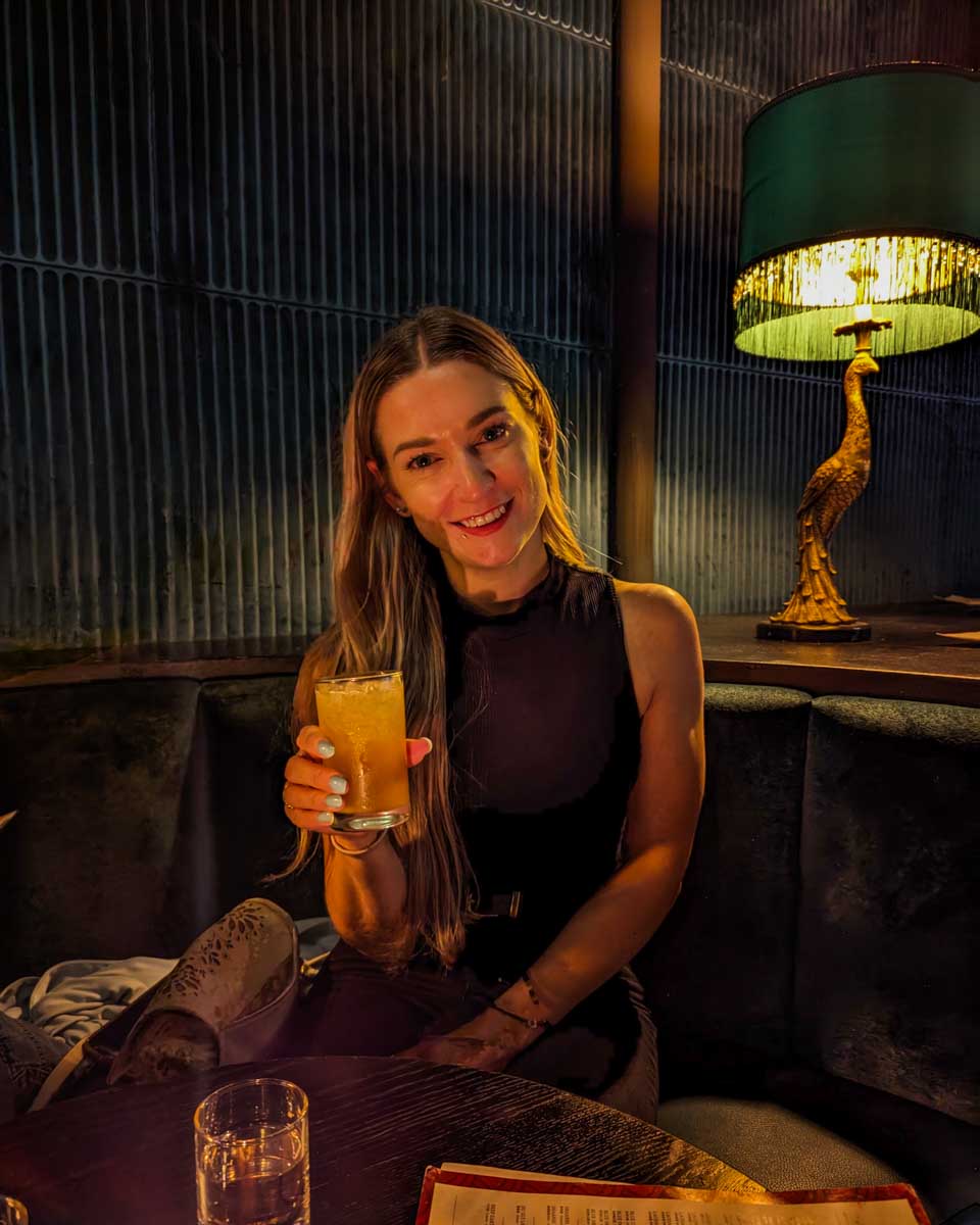 Bailey-drinks-a-cocktail-at Roxanne's in Boston Massachusetts