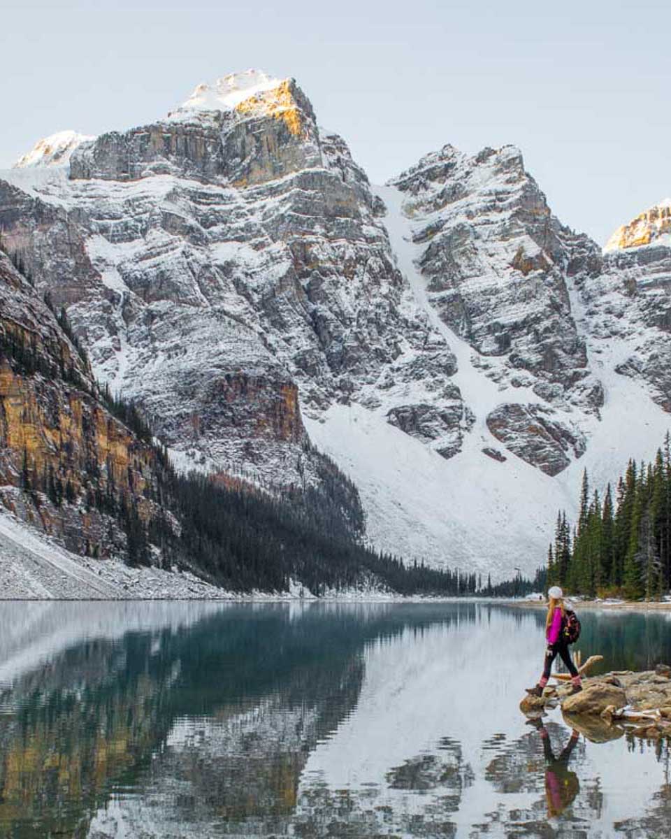 Bailey-walks-on-the-shoreline-on-Moraine-Lake-in-Banff-at-sunrise