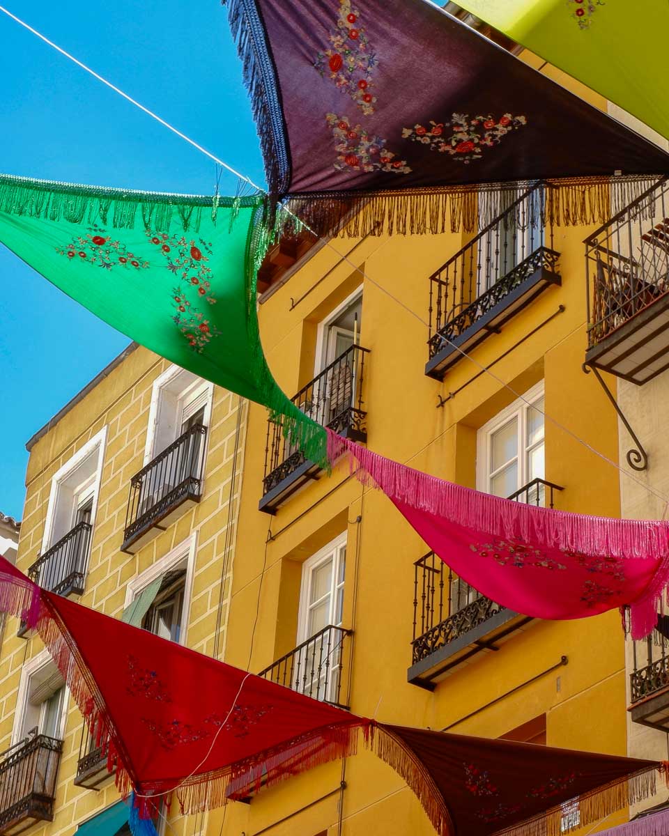 Colorful flags in the La Latina neighborhood of Madrid Spain