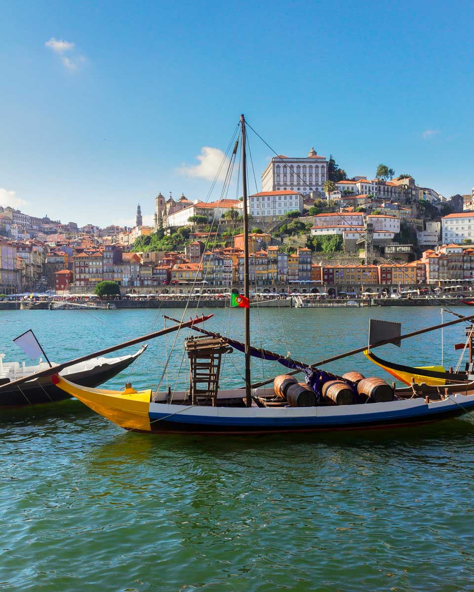 The Ribeira neighborhood an da fishing boat on the river in Porto Portugal