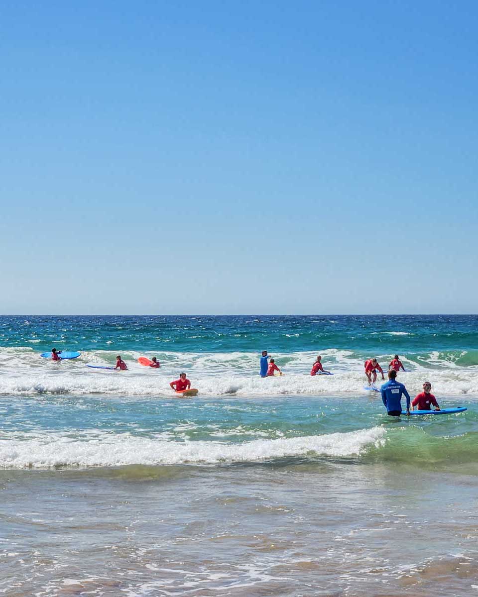 A-group-of-people-learn-to-surf-in Myrtle Beach South Carolina