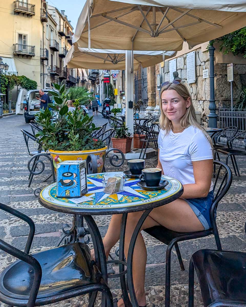 Bailey-drinks-coffee-at-a-cafe-in-Corfu-Greece