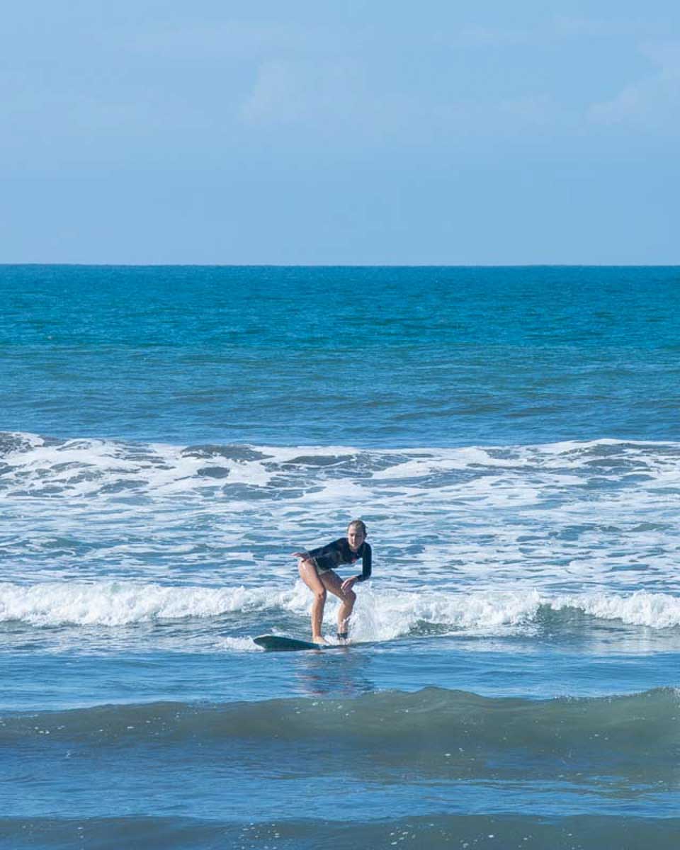 Bailey surfs during a learn how to surf class in Myrtle Beach South Carolina