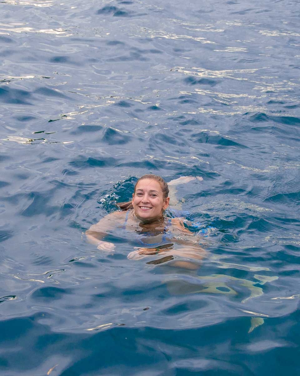 Bailey-swims-in-a lake after a smoke sauna on a tour from Helsinki Finland