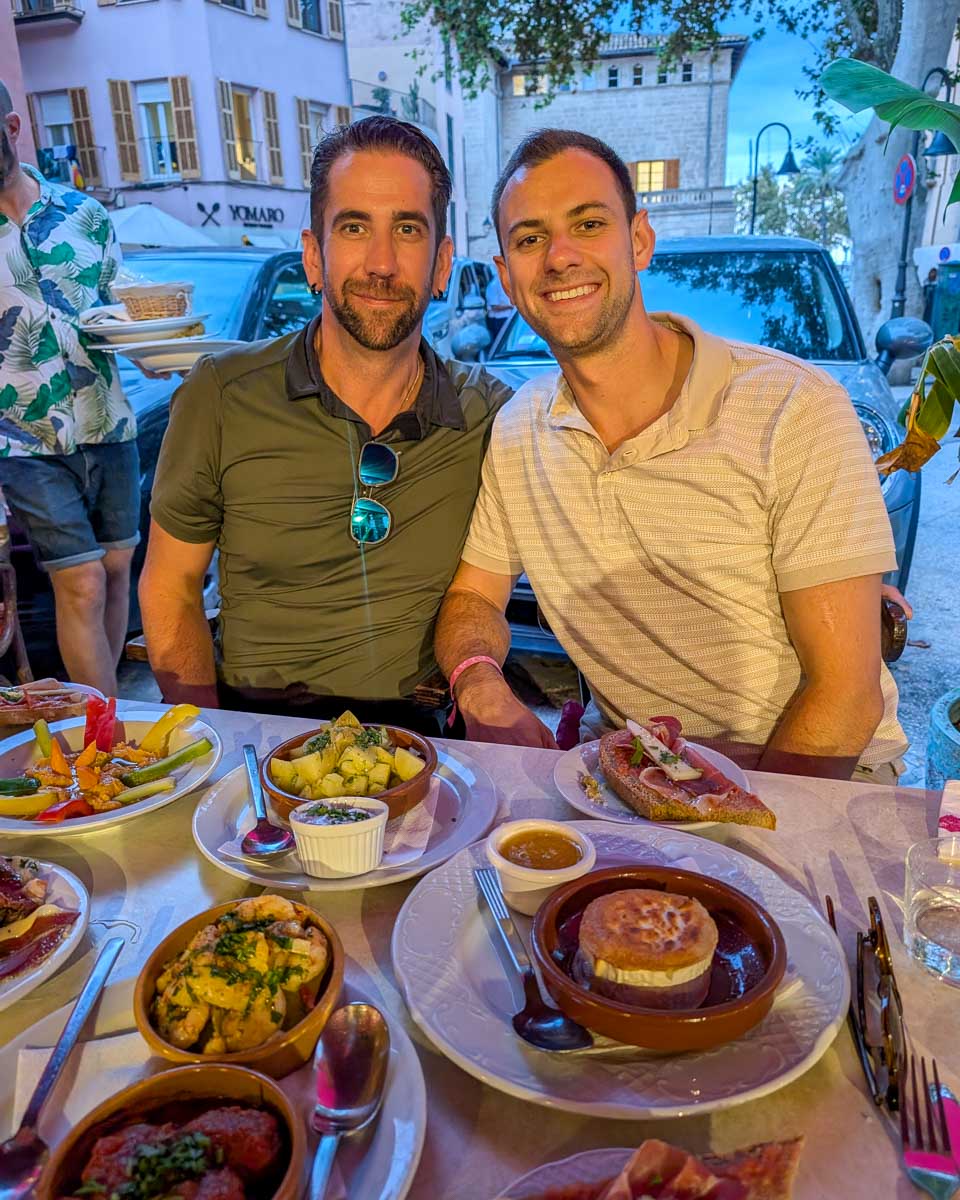 Daniel and friend enjoy dinner on a food tour in Lake Como Italy